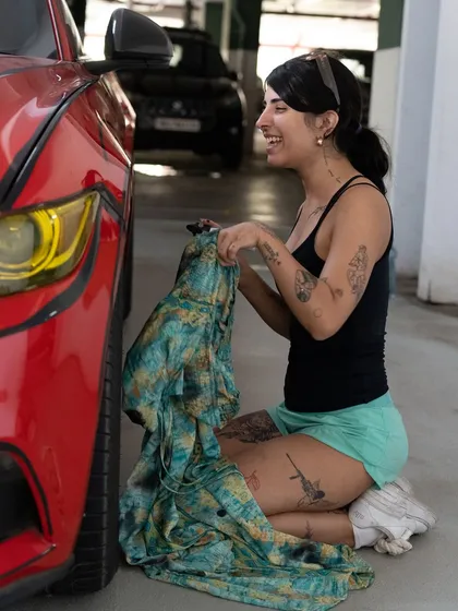 A moment of laughter during the intense Mustang painting session.