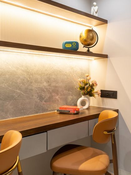 A study space that speaks volumes, not just in style, but in intention. From the rich warmth of the tan chair to the sleek sophistication of HDHMR wall panels, every element is designed to inspire focus while reflecting elegance.