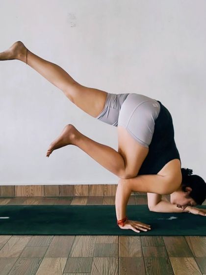 This is the Funky Flying Crow Pose, an asymmetrical arm balance that adds a creative challenge to your practice. It's a fun way to play with balance and build unilateral strength.