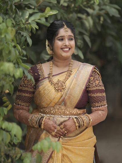 The bride's smile says it all. The makeup enhances her features without overpowering them.