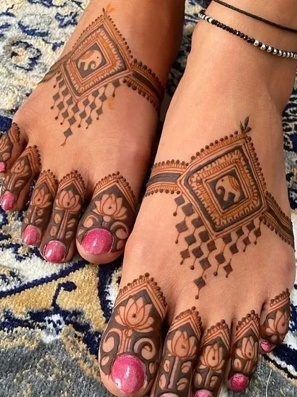 Don't forget the feet! I create beautiful foot mehndi, or payal designs, that complement your hand mehndi. This design features traditional elephant motifs inside a geometric pattern, with delicate lotus details on the toes.