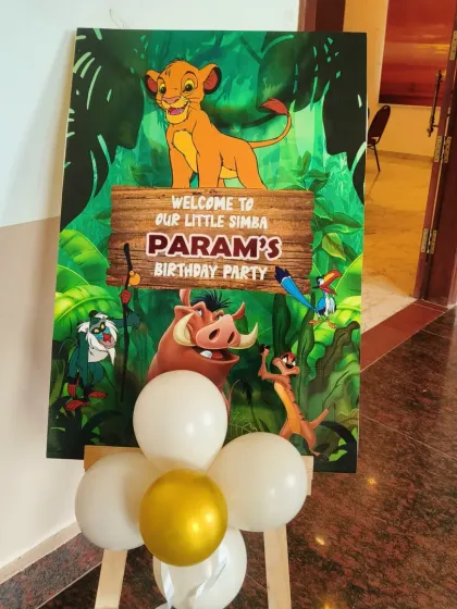 A personalized welcome sign is a great way to greet guests. This one, for a Jungle Safari party, features Simba from The Lion King and welcomes guests to "Param's Birthday Party."