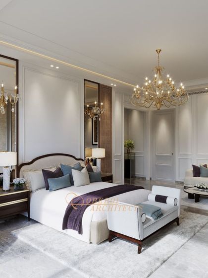 The full view of this expansive bedroom highlights its grandeur, with high ceilings, multiple mirrors, and a carefully curated furniture layout.