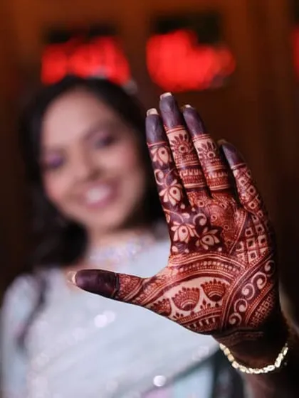 A close-up of the gorgeous, dark stain on the palm. The contrast between the stained skin and the fine lines is what makes the design pop.