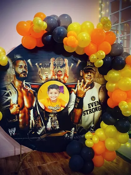 Get ready to rumble with a WWE wrestling theme! This party features a custom backdrop with John Cena and a personalized photo of the birthday boy.