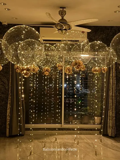 For a touch of pure magic, I designed this fairy-light bubble balloon installation. These large, clear balloons filled with twinkling lights create a floating, ethereal effect that can transform any room into a fairytale setting, perfect for an intimate birthday surprise at home.