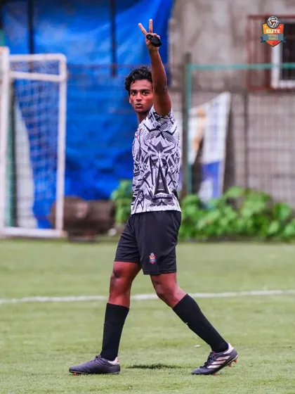 A player celebrating with a peace sign, cool and confident after making an impact on the game.