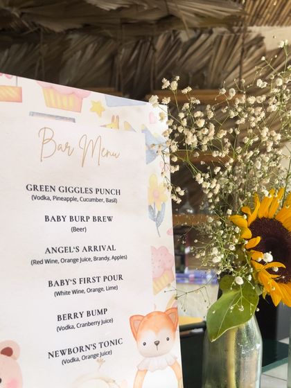 Even the bar menu was on theme for this baby shower. We created a custom menu with playful drink names like "Green Giggles Punch" and "Baby Burp Brew," adding a touch of fun to the celebration.