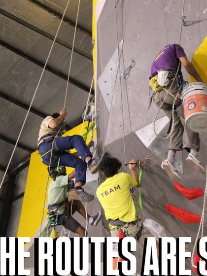 The routes are set. Our team, harnessed and ready, works high on the walls to prepare for the competition. This is where the magic begins.