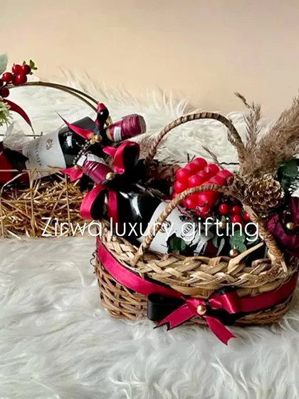 From opulent wine hampers to exquisite decor, I craft every detail to make your Christmas season unforgettable. These two wine baskets show different styles in a festive red theme.
