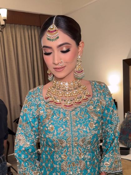 A close-up with eyes closed, showing the beautiful blend of neutral eyeshadows that create a defined yet soft eye look.