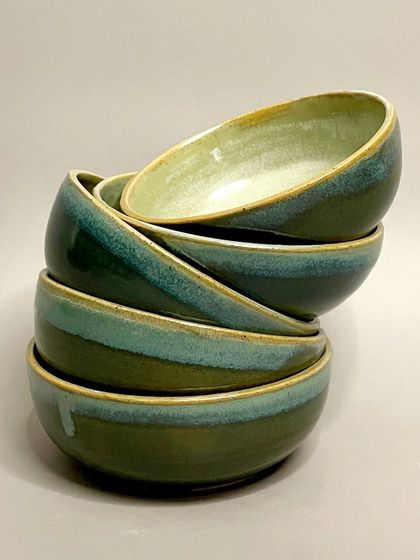 Elevate your everyday dining with this collection of handcrafted ceramic bowls. Finished in a beautiful dripping green and blue glaze, each bowl is lovingly crafted and truly unique.