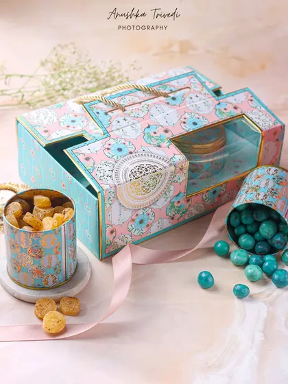 A playful and colourful hamper box with assorted candies and cookies. The pastel colours and whimsical design make it a great option for gifting to all ages.