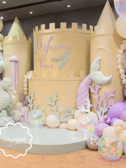I designed an enchanting underwater kingdom for Mihana's mermaid-themed birthday. This magnificent castle backdrop, adorned with pastel balloon bubbles and iridescent details, was the centerpiece of a truly magical deep-sea adventure.