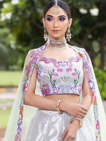 A full-length view of the dreamy Mehendi look, showing the unique cape-style dupatta and the soft, romantic feel of the overall look.