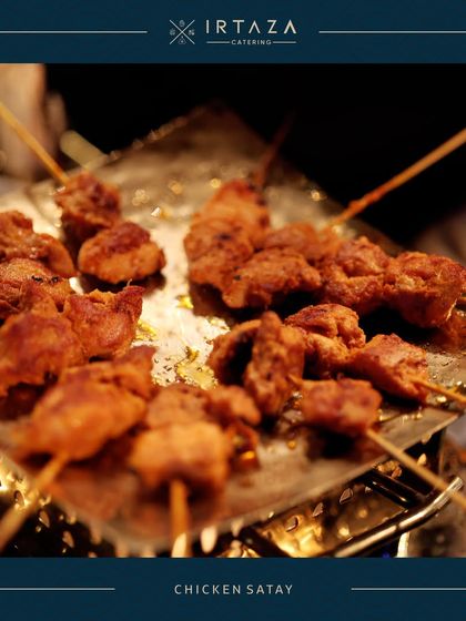 Juicy Chicken Satay skewers, grilled to perfection. This is a fantastic option for a live BBQ station, always drawing guests in with its irresistible aroma.
