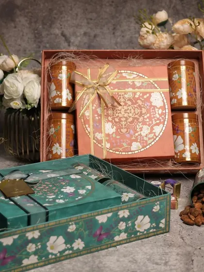 A set of two intricately designed gift boxes, one for dry fruits and one for other goodies. Offering coordinated sets is a great upselling strategy that we discuss in the workshop.