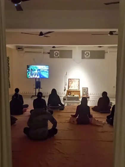 A view from behind the curtain, looking in on the Sangha. There is a beautiful sense of intimacy and shared purpose in these gatherings.