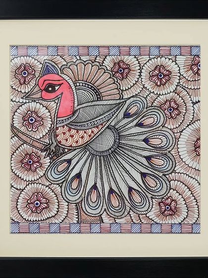 A proud peacock surrounded by a floral pattern, this Madhubani piece is a testament to the artist's control over line and color.