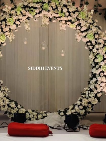 A full view of the magnificent floral circle, showcasing its scale and the intricate arrangement of white and green flowers, perfect for a grand statement.