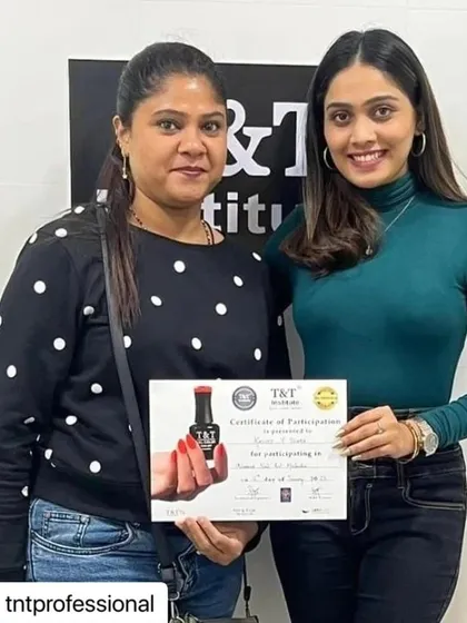 A participant from our recent Advanced Nail Masterclass in Mumbai receiving her certificate of participation. Continuous learning is key in this industry.