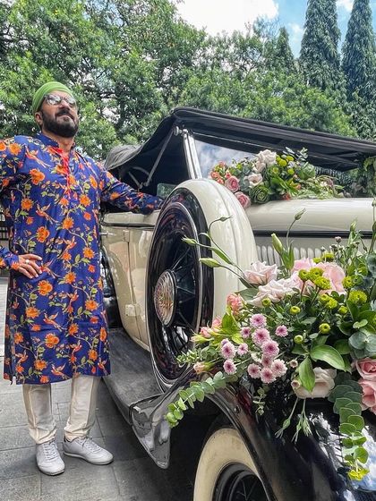 Baraat ready. A shot of me with the vintage car, all set to lead a beautiful and energetic wedding procession.
