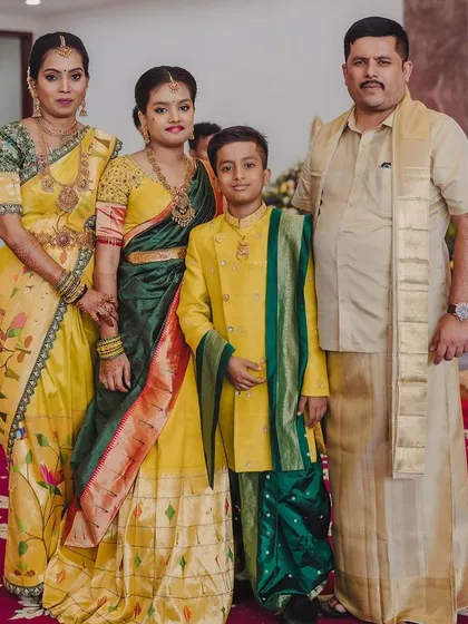 Another beautiful family portrait, this time in a vibrant yellow and green palette. I designed these coordinated outfits for a wedding, ensuring everyone from the parents to the children felt connected and stylish in their custom ethnic wear.