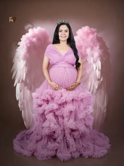 Feel like an angel with our fantasy-themed shoots. We provide beautiful props like these ethereal angel wings and royal crowns to pair with our collection of ruffled gowns, creating a truly magical and empowering photography experience.