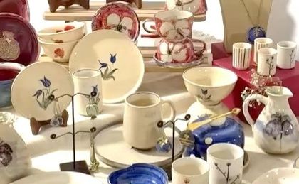 Another angle of the exquisite ceramic collection, showcasing a variety of shapes and hand-painted designs.