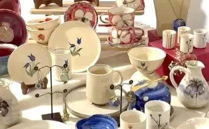 Another angle of the exquisite ceramic collection, showcasing a variety of shapes and hand-painted designs.
