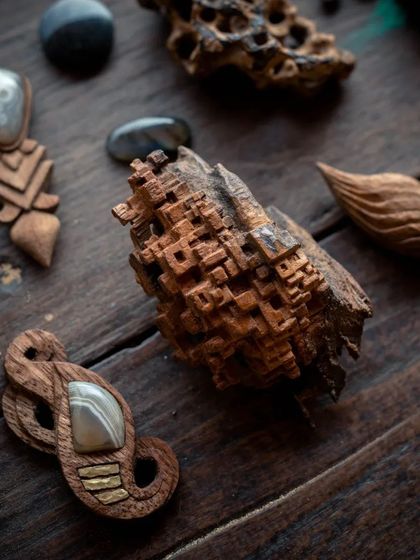 A close-up of a whittled piece with incredible geometric detail. This shows the advanced level of artistry that can be achieved through wood carving.