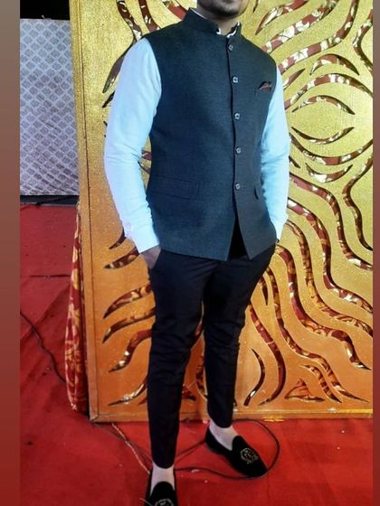 A client looking dapper in a dark Nehru jacket, also known as a bandi. I tailored this to be worn over a formal shirt for a sharp, Indo-western look.