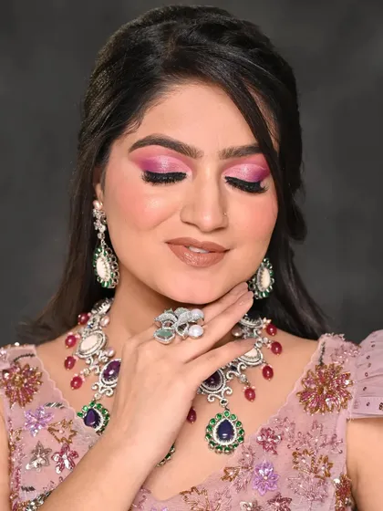A detailed close-up of the pink cut-crease eye makeup. You can see the clean lines and seamless blending of the eyeshadows, a testament to the technical skill required for such looks.