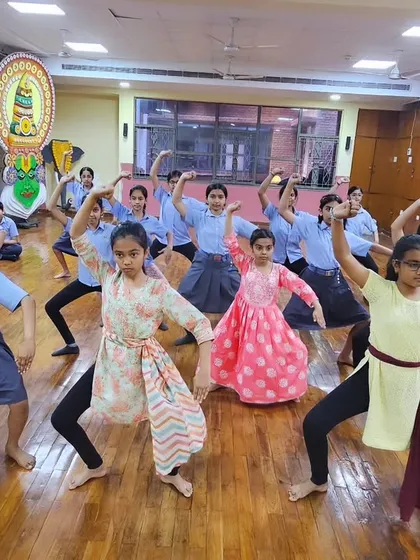 Another angle of our young students during their Chhau practice. Notice the determination and focus on their faces as they hold the pose.