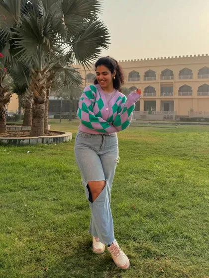 A happy, candid shot in my cozy cardigan. This is a great example of how to layer for transitional weather.
