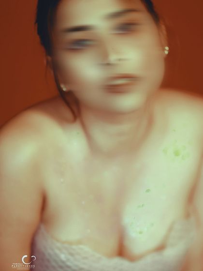 A close-up with motion blur that focuses on the expression. Even though blurred, the emotion is palpable.