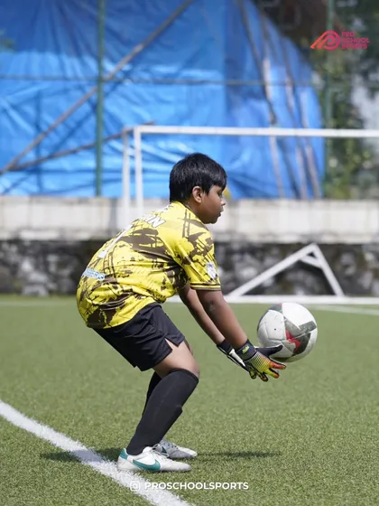 A young goalkeeper makes a save, a throwback to a crucial moment in a TYL match.