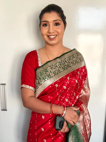 Another angle of the neat bun and HD party makeup. This timeless look ensures you look put-together and elegant throughout the event.