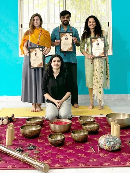 A group of newly certified sound healers, ready to apply their knowledge of vibrational therapy.