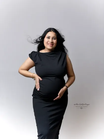 A joyful and candid-style portrait. The wind in her hair and the bright smile capture a moment of pure happiness and anticipation.