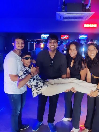 A duplicate of image 69, showing a group of friends having a fun, playful moment.