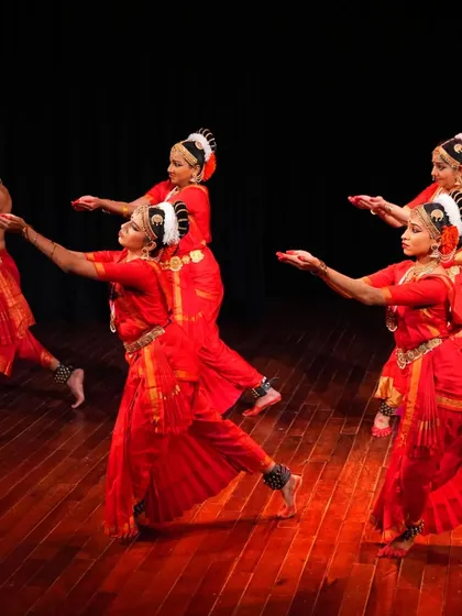 This image from our 'Raṅg' performance captures the dynamic footwork and coordinated movements that define the Vempati Chinna Satyam style I teach.