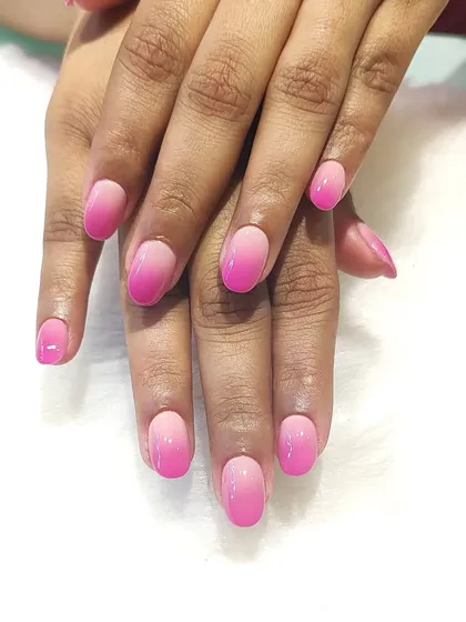 Pink dreams and ombré goals. This is a perfect example of a soft pink gradient, blending from a light, milky pink to a brighter shade at the tips.