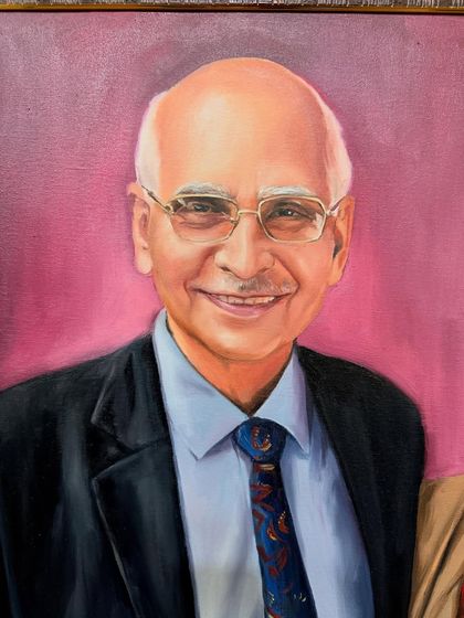 A close-up of the father from the same family portrait, focusing on his kind expression.