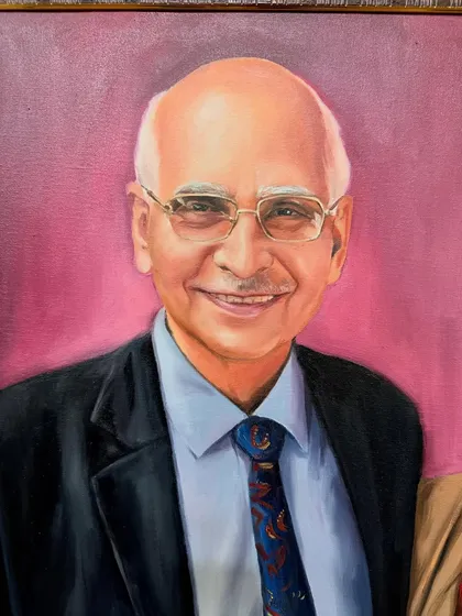 A close-up of the father from the same family portrait, focusing on his kind expression.