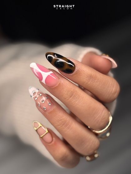 A wild and fun mismatched set. This look combines hand-painted animal prints, cow spots, and abstract designs with rhinestones and gold accents.