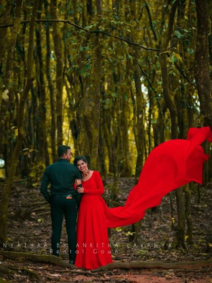 Another beautiful shot from the forest photoshoot, showing how the red gown stands out against the natural backdrop.