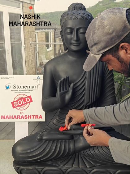 An artisan adds a final touch to this 3-foot black marble Buddha statue, sold to a client in Nashik, Maharashtra. The matte black finish gives it a distinctly modern and sophisticated look.