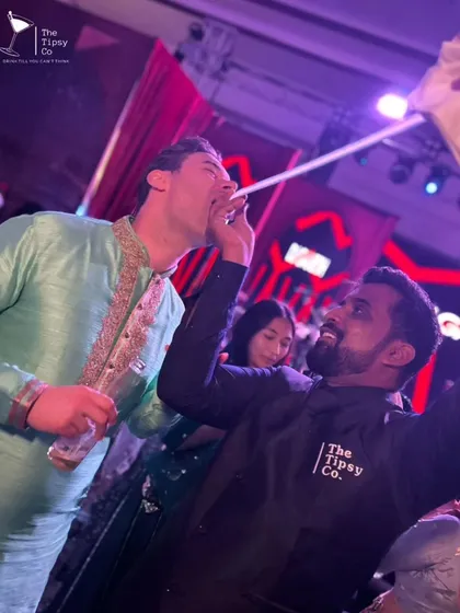 The party doesn't stop at the bar. Our team roams the dance floor with shot dispensers, making sure the energy stays high and the drinks keep flowing.