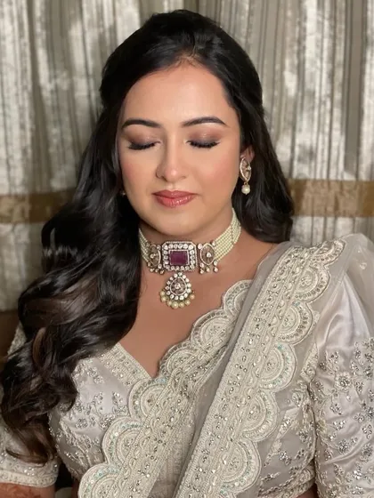 A close-up of Krusha's dreamy sangeet look. The soft brown smokey eye and glossy nude lip were the perfect combination for her elegant attire.